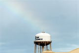 Rainbow landing on water tower